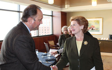 Craig Borr, MECA President/CEO, greets U.S. Sen. Debbie Stabenow at an electric co-op meeting in Lansing. MECA and its electric co-op members work to build a close working relationship with elected officials on behalf of the co-ops’ consumer members. 