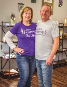 Janene & Scott Rawlinson standing in their lavender shop